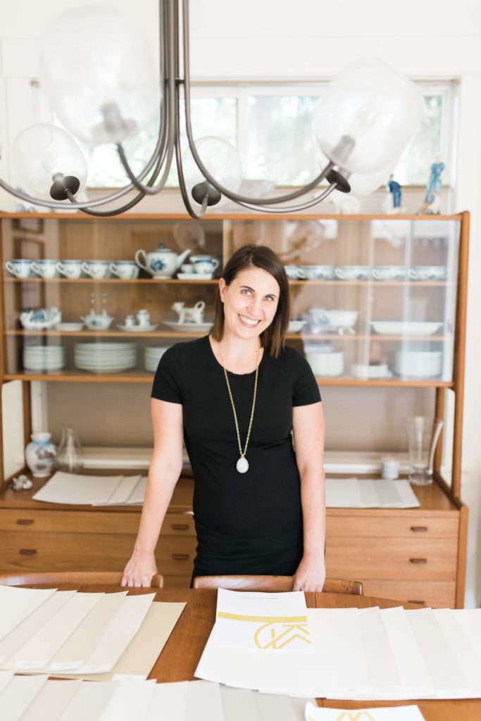 Krissy Peterson standing at work table