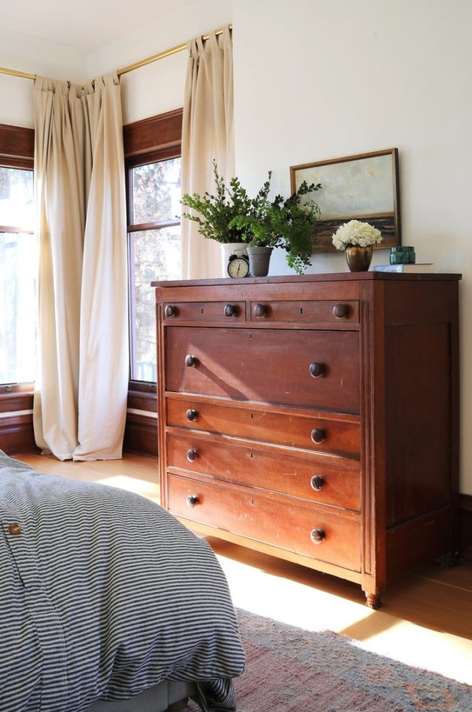 A vintage dresser in a master bedroom.