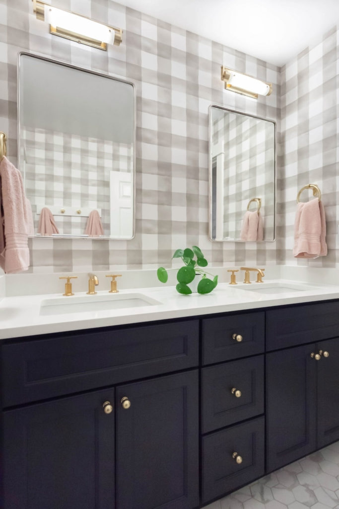 Girl's Bathroom with checkered wallpaper and mixed metal finishes in Redmond, WA