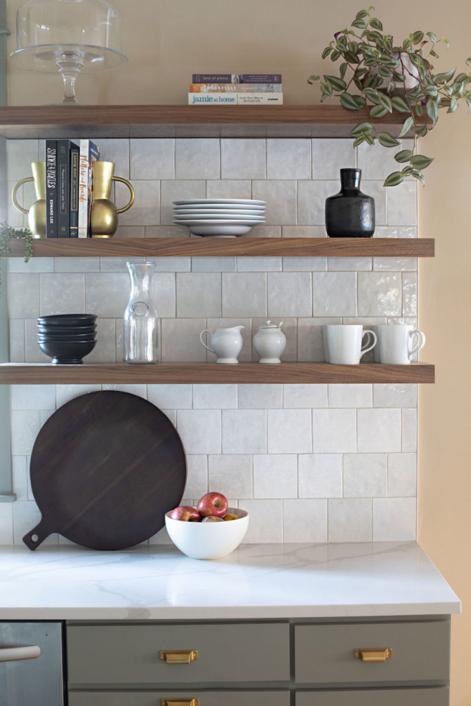 open shelving with white tile backsplash