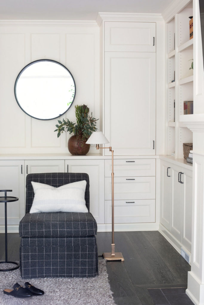 sitting area with grey plaid slipper chair
